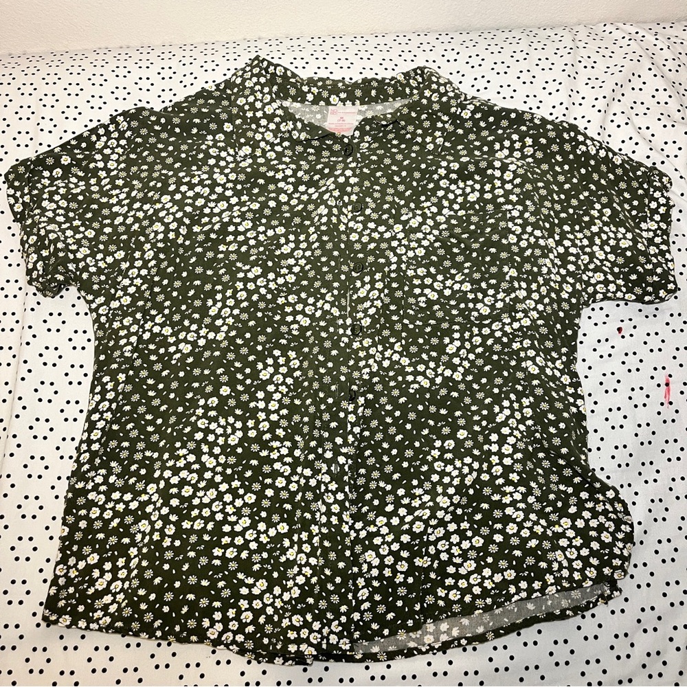 A button down green flower shirt.